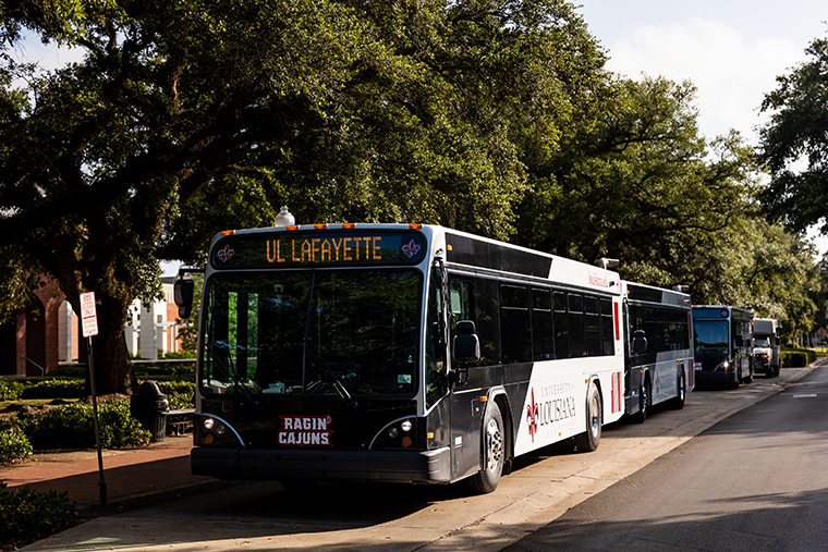 UL Lafayette buses drive down St. Mary Blvd.