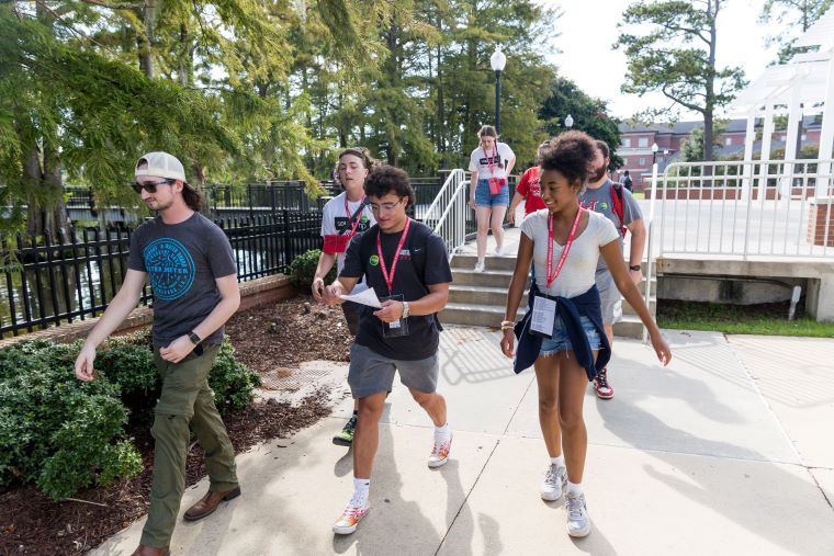 SOUL Camp attendees walk by Cypress Lake 