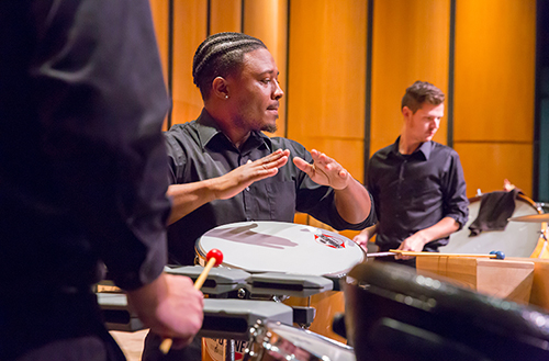 UL student playing bongo drums in the percussion section