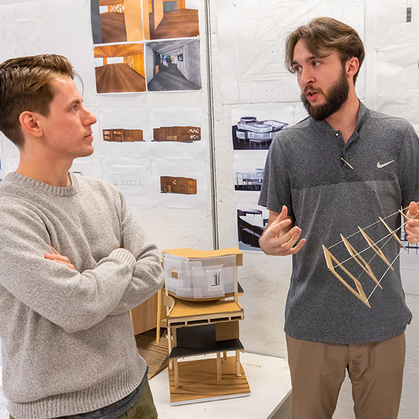 Architecture students discuss designs