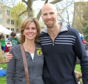 Online Healthcare Administration graduate Jason LaSuzzo smiles with his wife outdoors.