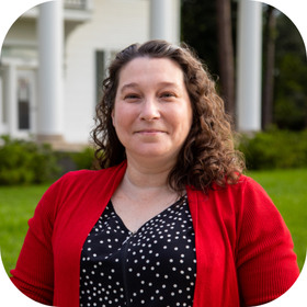 Instructional Designer Andrea Leonard pictured in front of UL Lafayette's Whittington House.