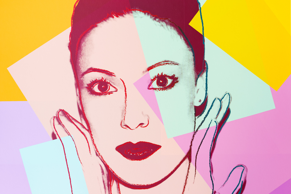 A pop art portrait by Andy Warhol featuring a woman's face.