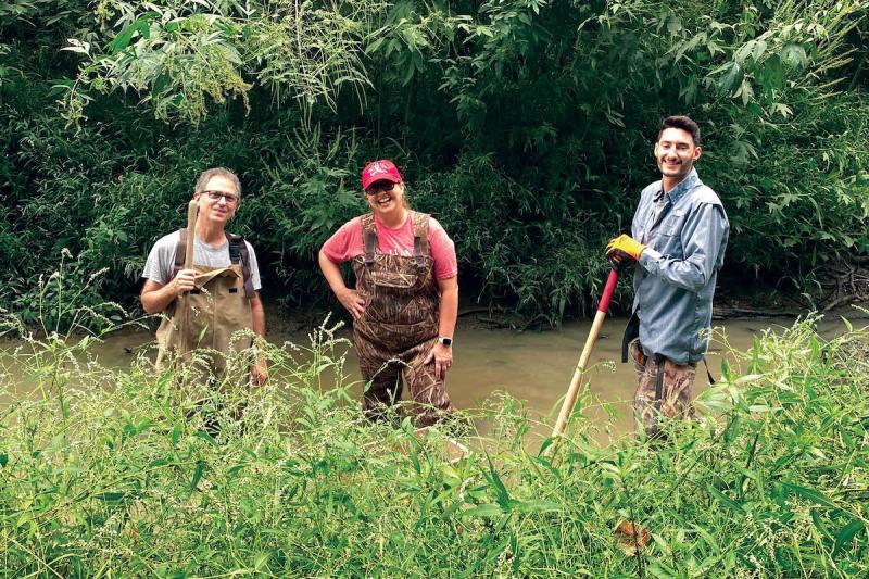 UL Lafayette Science Museum director Jennifer Hargrave, a volunteer and graduate student help to uncover a mastodon tooth in Church Point, Louisiana.
