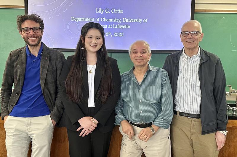 Lily Ortte standing with UL Lafayette chemistry faculty.